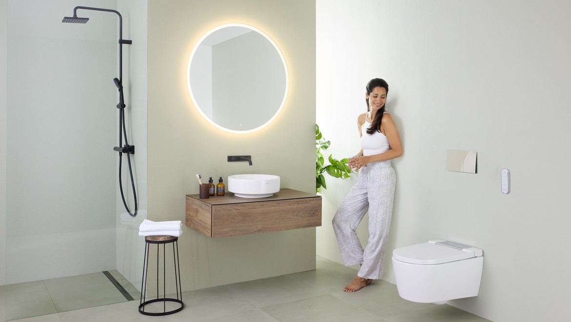 Woman in a minimalist bathroom Woman in a minimalist bathroom
