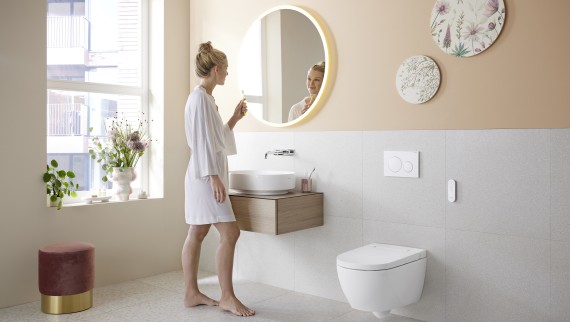 Bathroom in trendy Peach Fuzz with the Geberit AquaClean Alba shower toilet Bathroom in trendy Peach Fuzz with the Geberit AquaClean Alba shower toilet