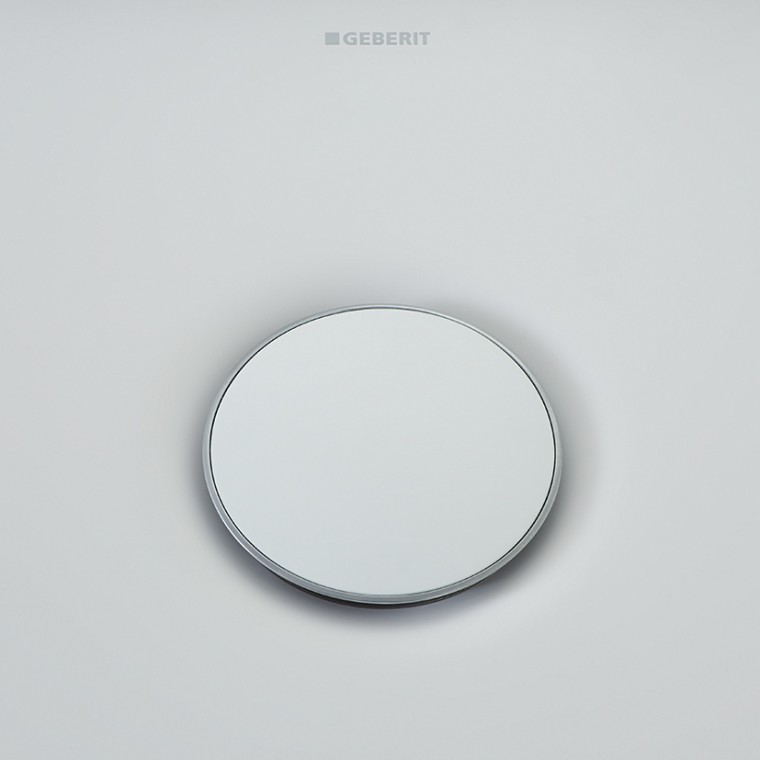 Geberit Olona drain cover surrounded by a slim chrome ring Geberit Olona drain cover surrounded by a slim chrome ring