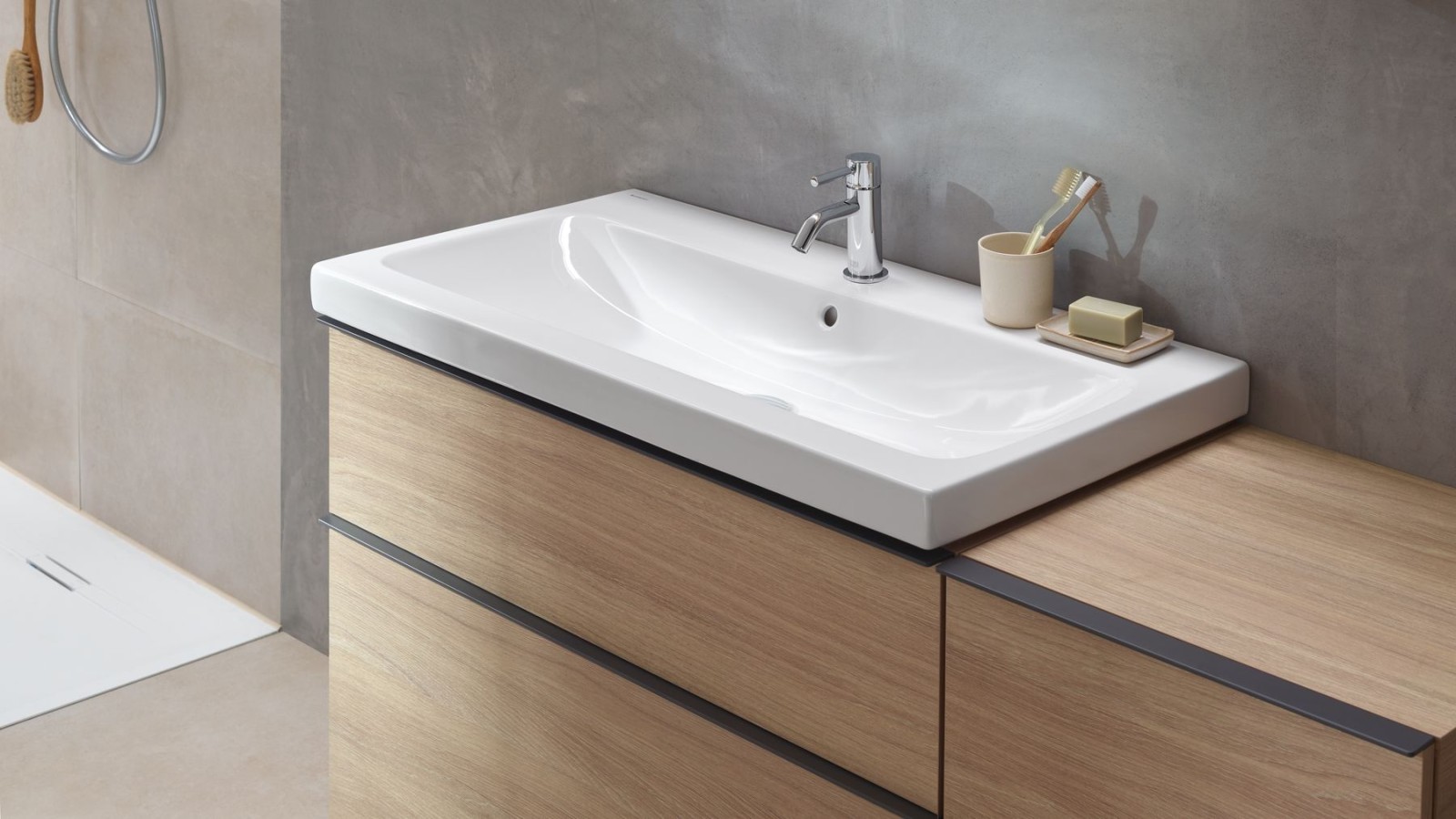Washbasin area with bathroom furniture made of wood from the Geberit icon series Washbasin area with bathroom furniture made of wood from the Geberit icon series
