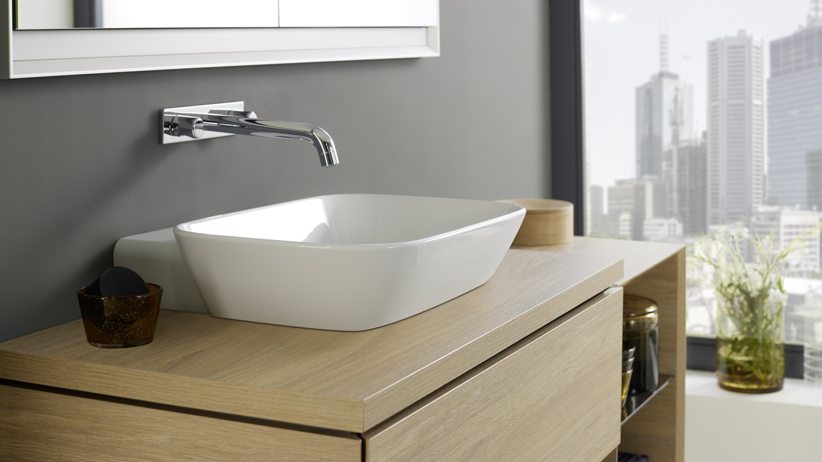 Washplace with Geberit ONE lay-on washbasin and bathroom furniture made of wood Washplace with Geberit ONE lay-on washbasin and bathroom furniture made of wood